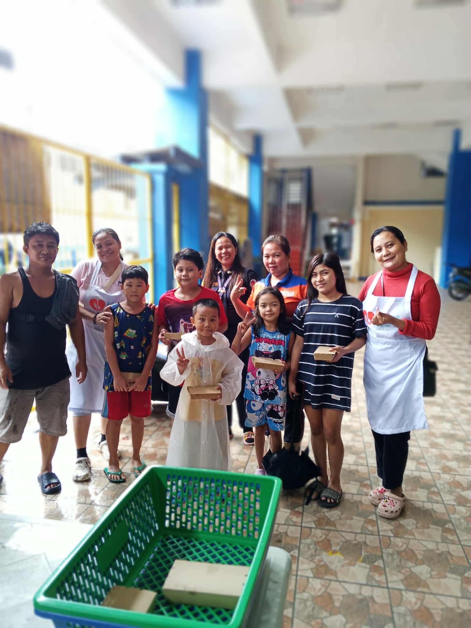 Volunteers and community members together after the food distribution.